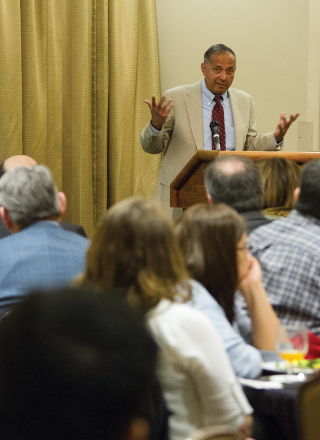 Dr. Shanto Iyengar speaking at the podium