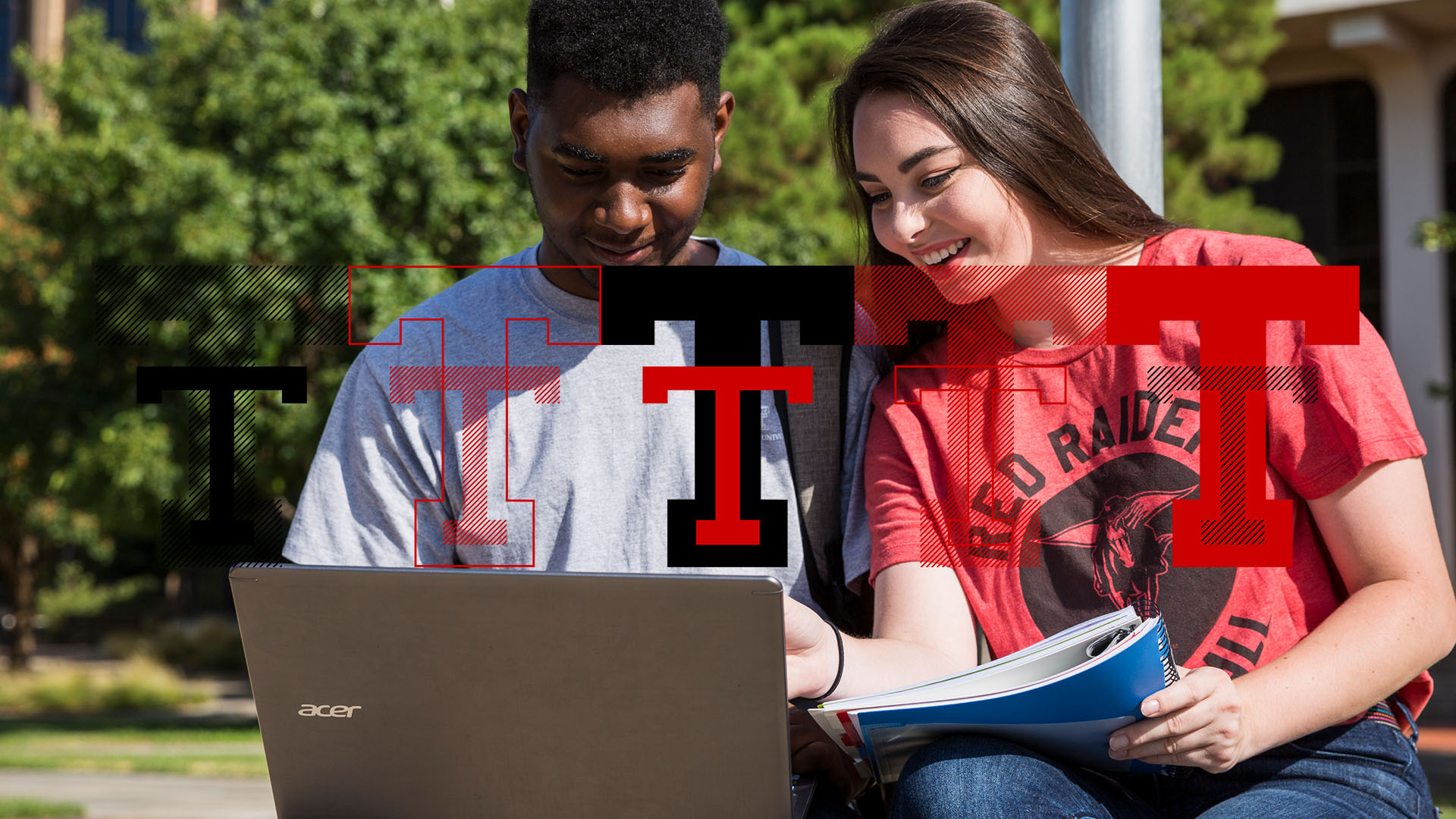 Two students looking at laptop