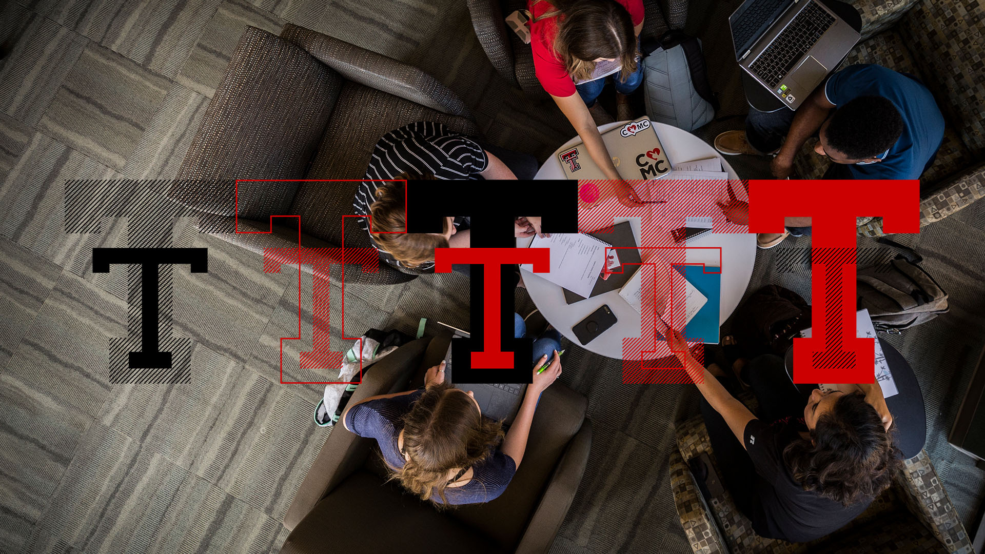 Group of students studying around table
