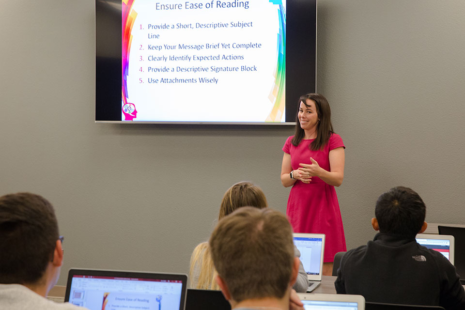 Professor speaking to students in front of class