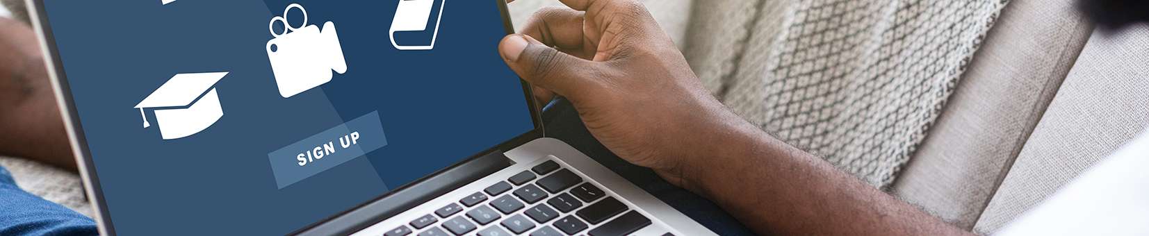 Photo of a student signing up for eLearning classes on a laptop