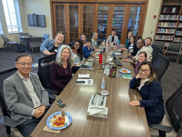 Department faculty around a conference table