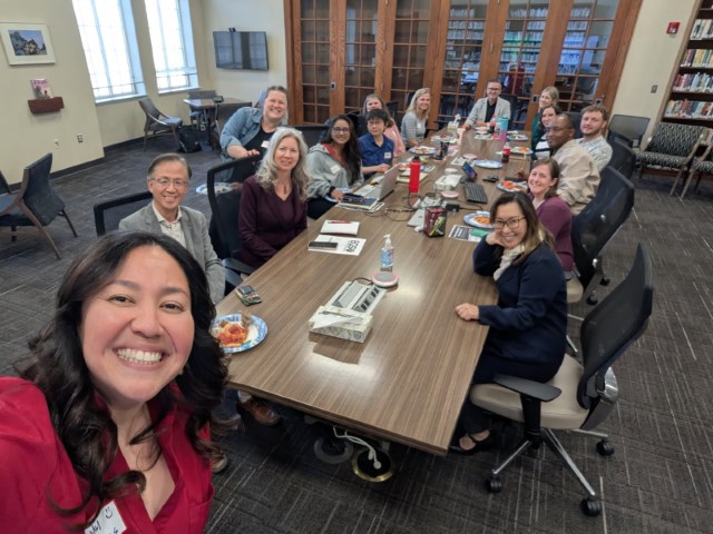 Department faculty around a conference table
