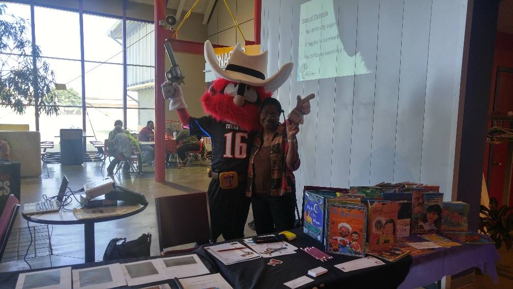 Amma and Raider Red at the Literacy Fair