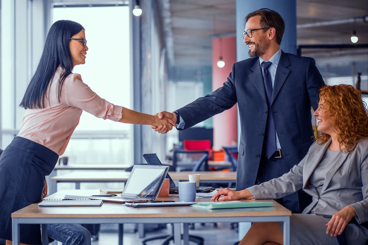 Businesspeople shaking hands.