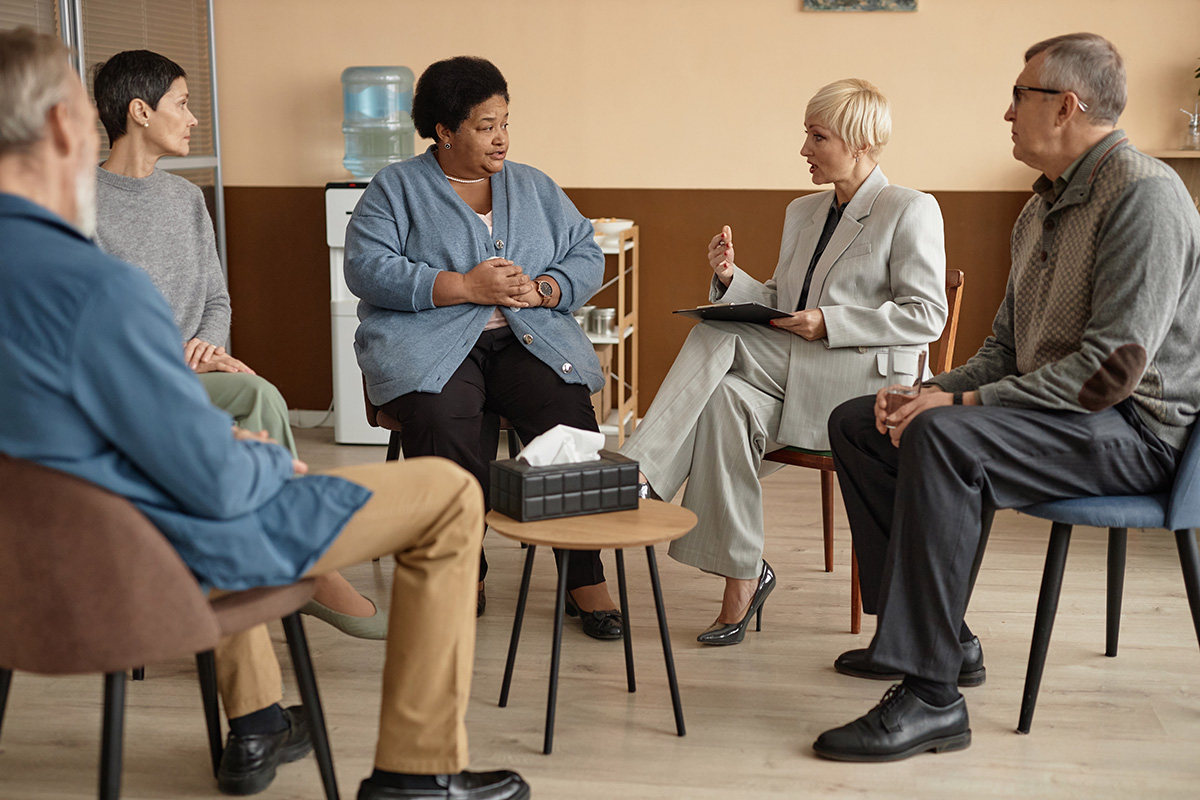 Counselor and group engaged in discussion.