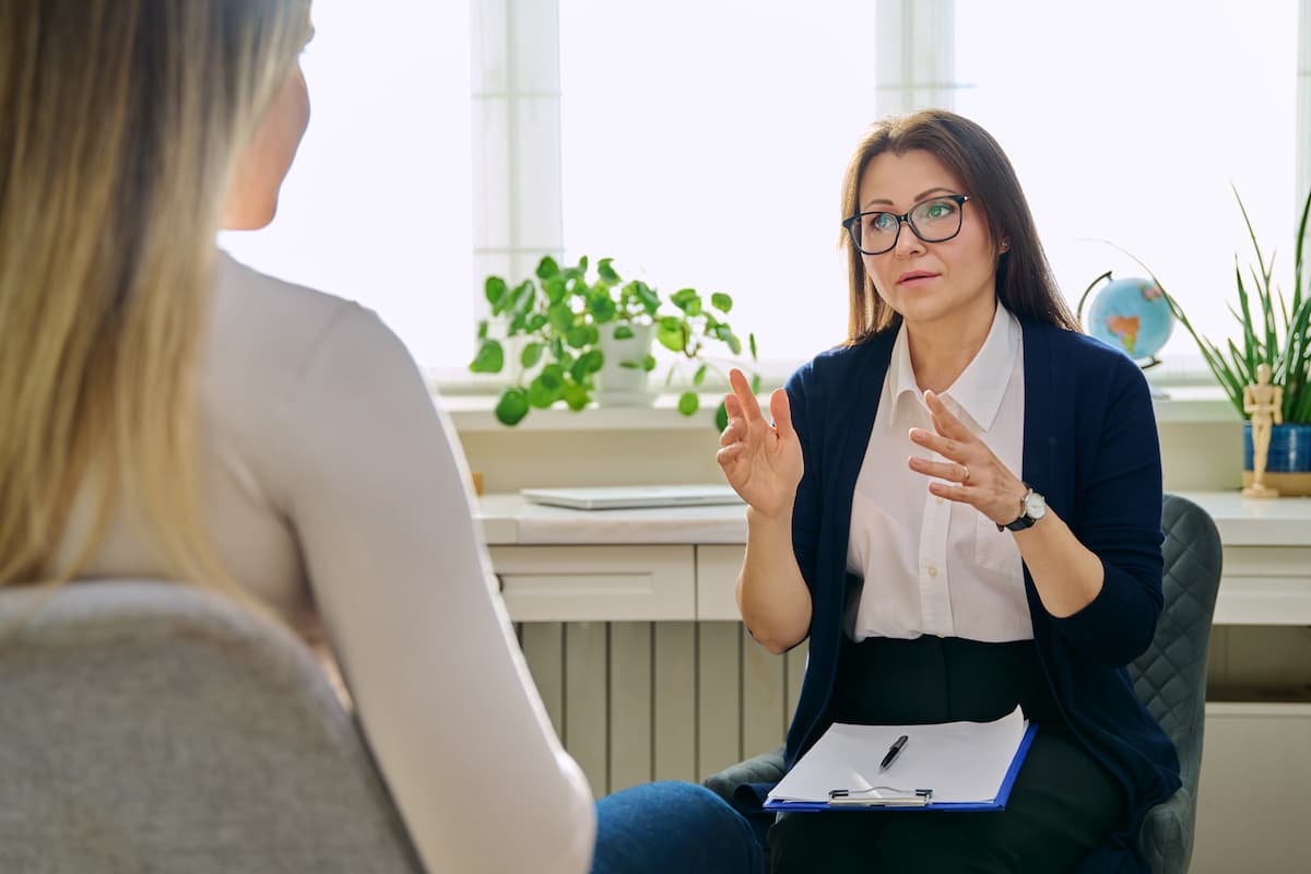 Mental health counselor and client.