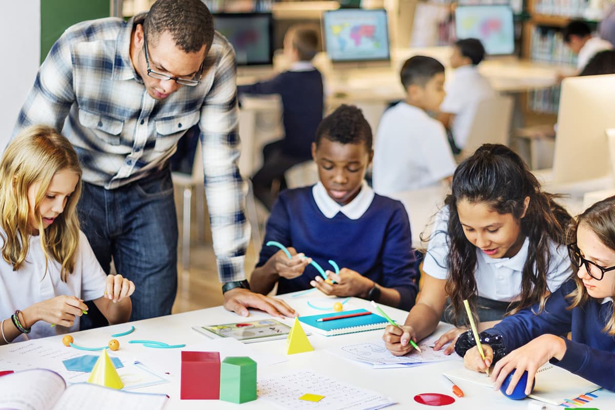 Teacher Supervising Student Project