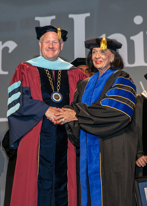 Faulkner University President Mike Williams presents Jere Lynn Burkhart with the degree of Doctor of Humane Letters at the university's Annual Benefit Dinner on Oct. 4, 2018.