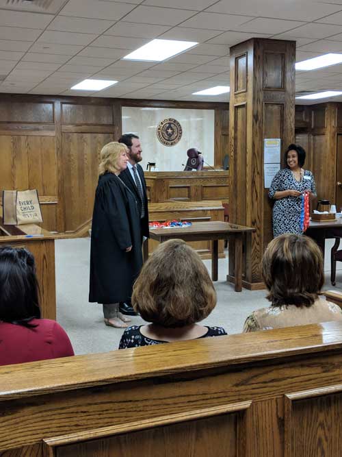 Assistant Professor Daniel Kelly is sworn in as a CASA volunteer Oct. 10 at the Lubbock County Courthouse.