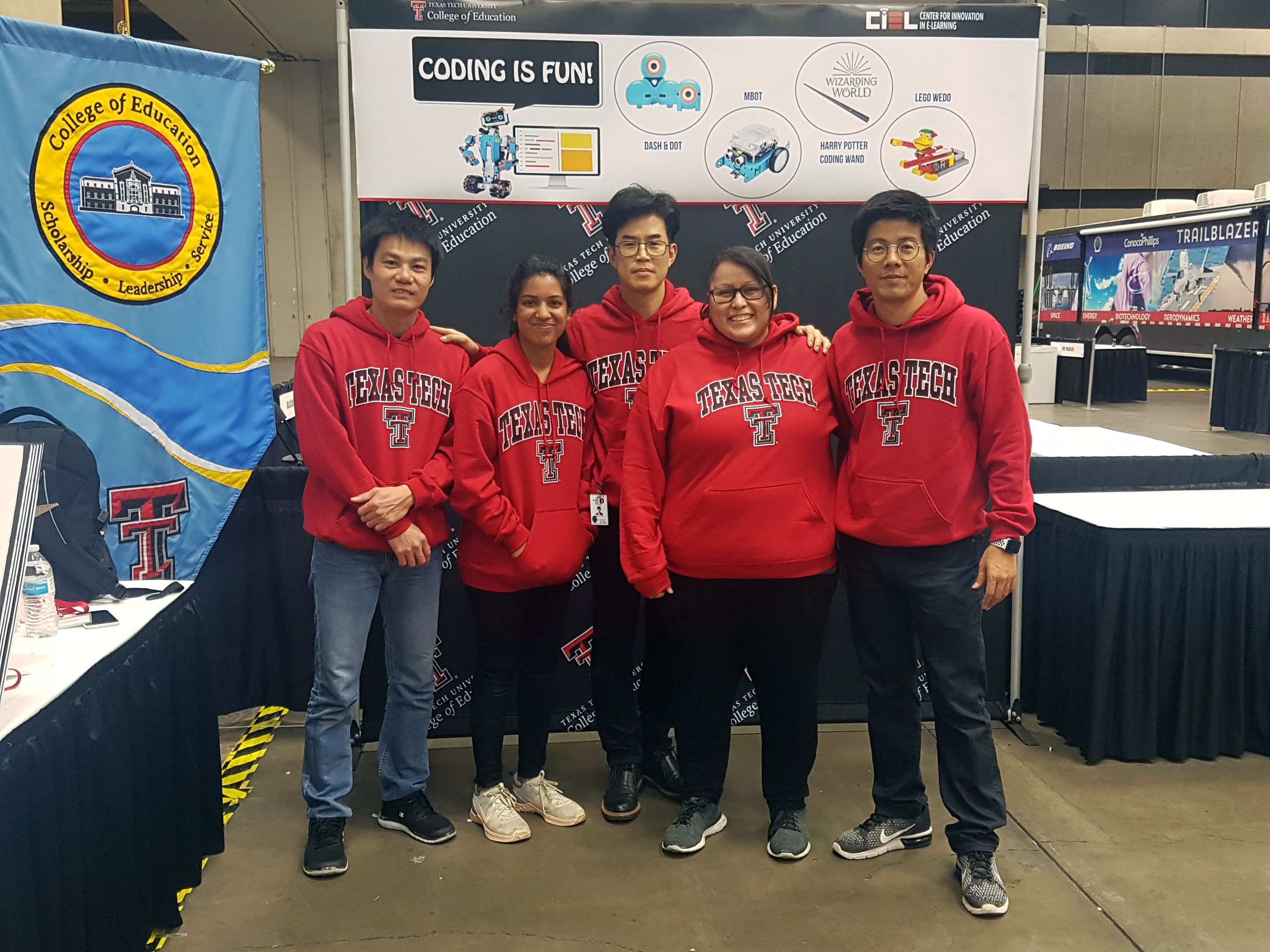 Dr. Jongpil Cheon, center, and his team at the Center for Innovation in eLearning (CIEL) were at the Dallas ISD STEM Expo, aiming to inspire students to consider a STEM education.  From left: Research Assistant Danh Nguyen, Research Assistant Navya Yenuganti, Cheon, Blackboard Specialist Amanda Solis, Research Assistant Hyunchang Moon.