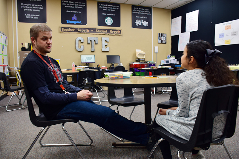 Sam Thompson works with a student at Slaton ISD