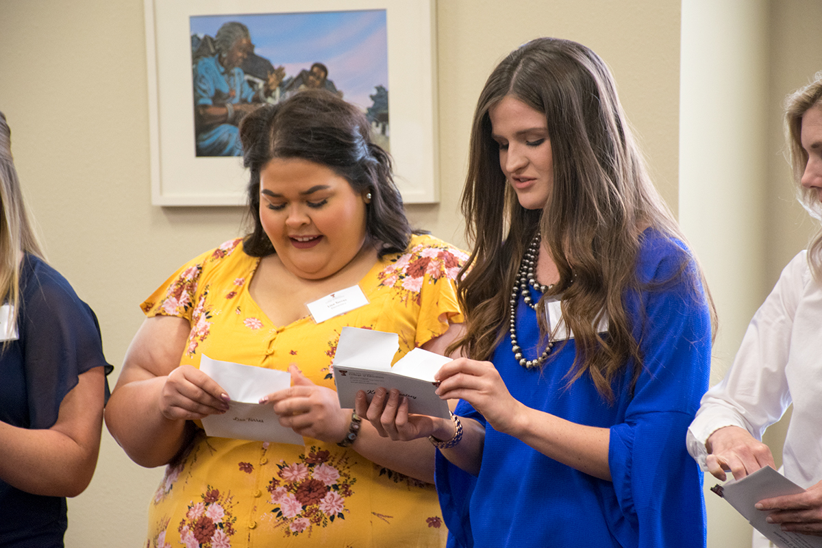 Students opening letters at a Texas Tech University match ceremony