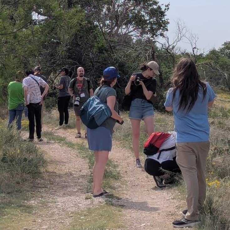 Group of students hiking on a trail