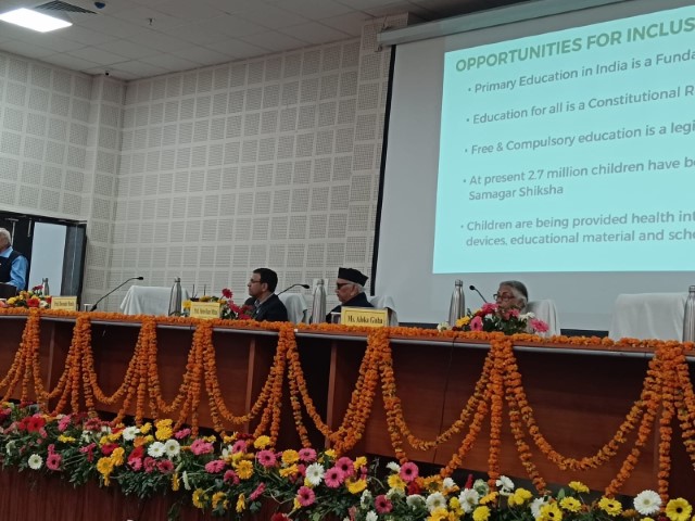 Dr. Banda on a panel in India