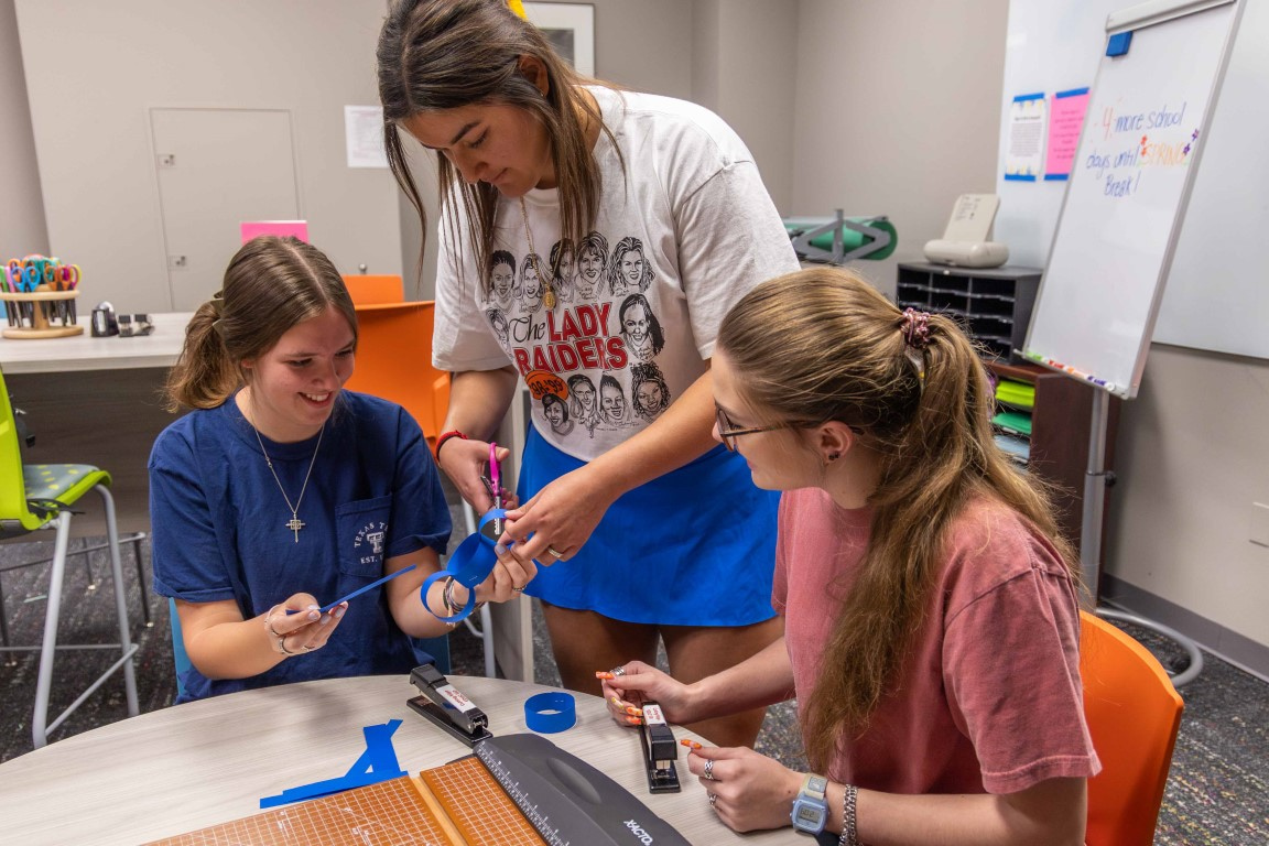 three students using the Cutting Edge resources