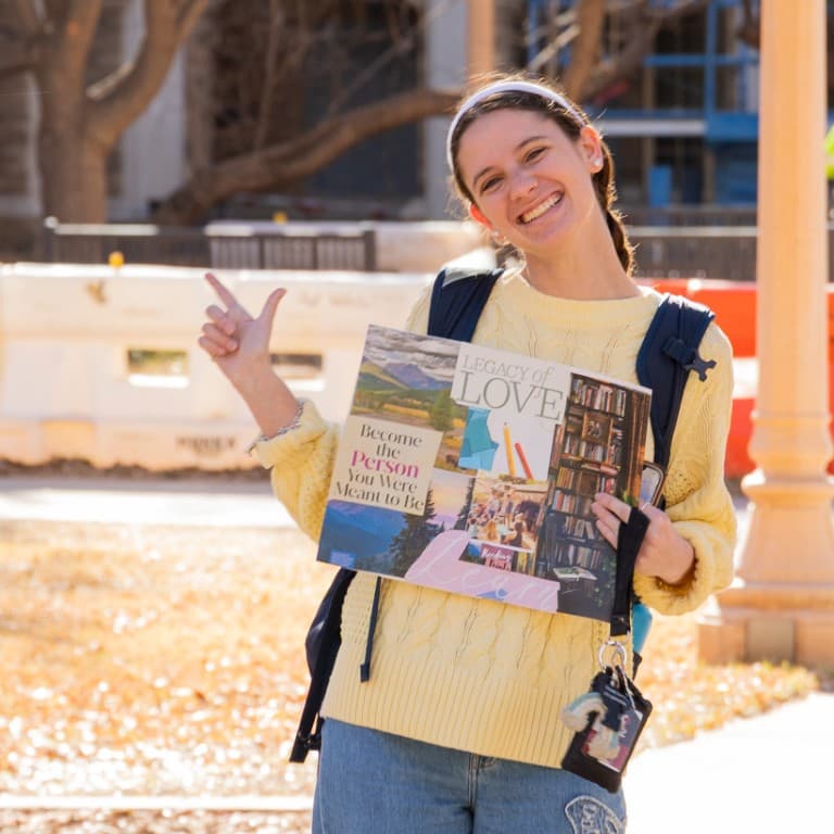 Student giving the Guns Up on the first day of class