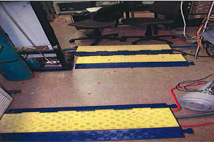 Red dots on floor indicate glass shards at end of lab farthest from explosion in hood.