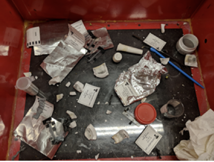 Area in protective reaction chamber where grinding and detonation took place.