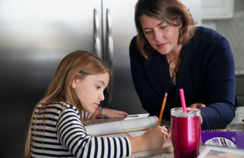 Photo of Tenlee and her mother studying.