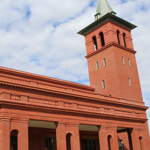 Photo of red brick building with tower