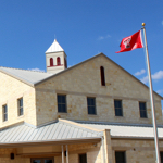 Photo of building with a flag