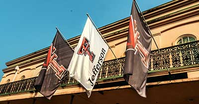 Texas Techh Flags Outside the Jeffersonian Institute