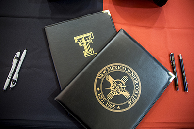 Two portfolios stacked on top of each other displaying the TTU and NMJC logos