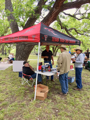 Dr. Tom Arsuffi (left) and Robert Stubblefield share a laugh with birders visiting the TTU booth at the First Annual South Llano River State Park Birding Festival.