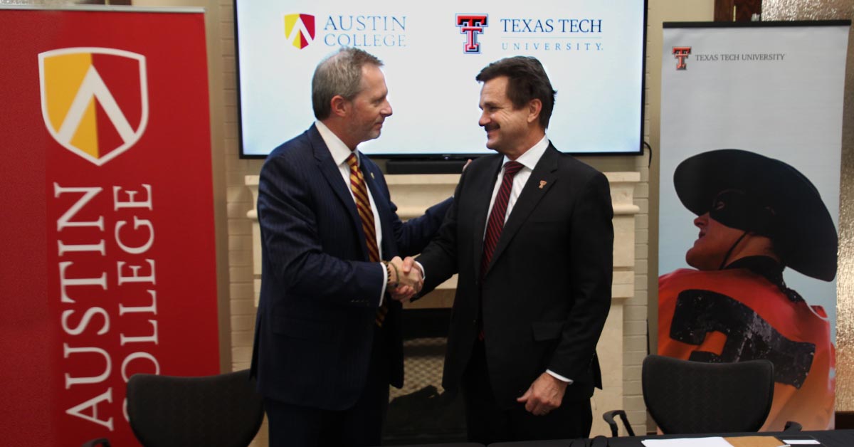image of President Schovanec shaking hands with an Austin College representative
