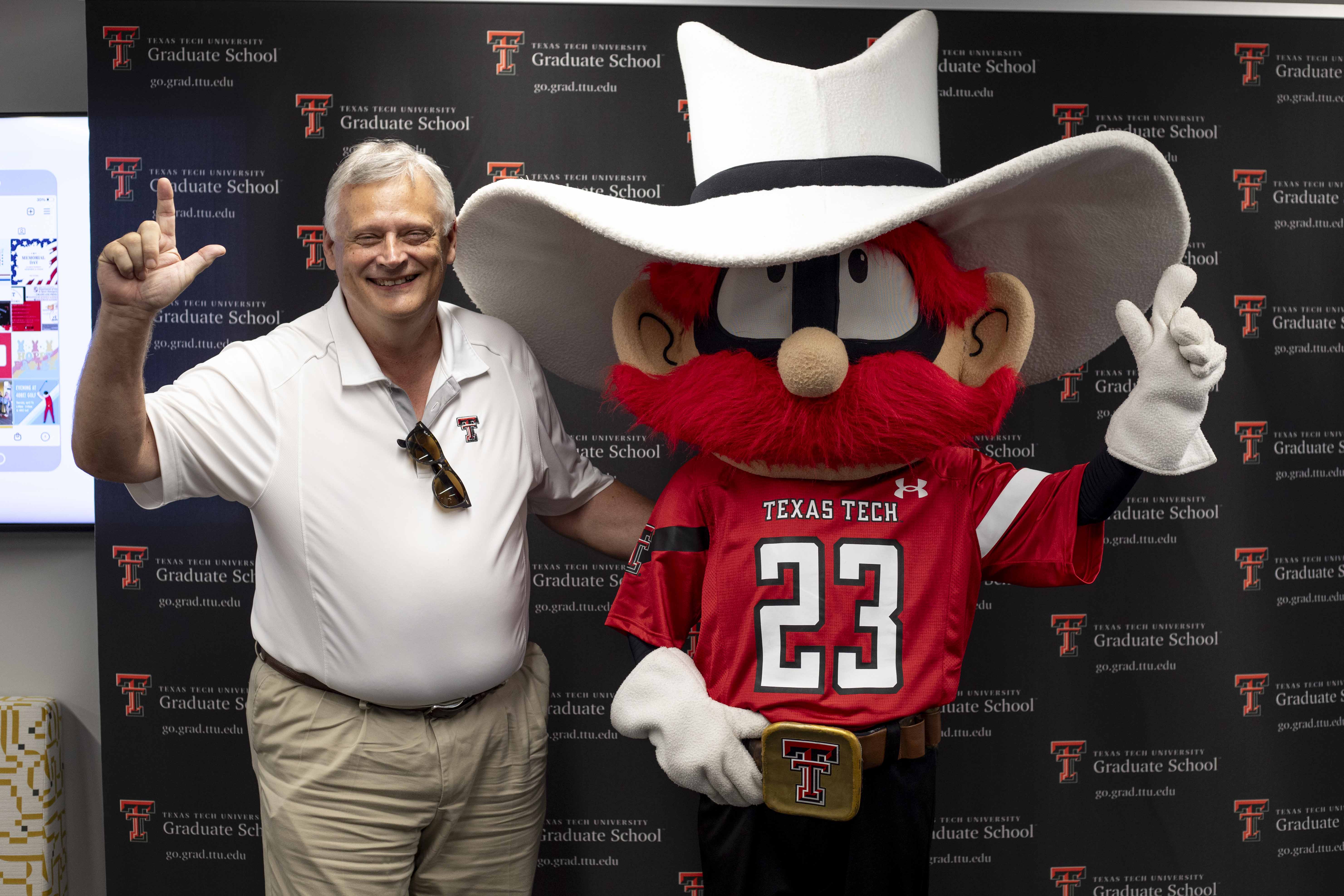 Mark Sheridan & Raider Red Posing for Graduate School Welcome Week