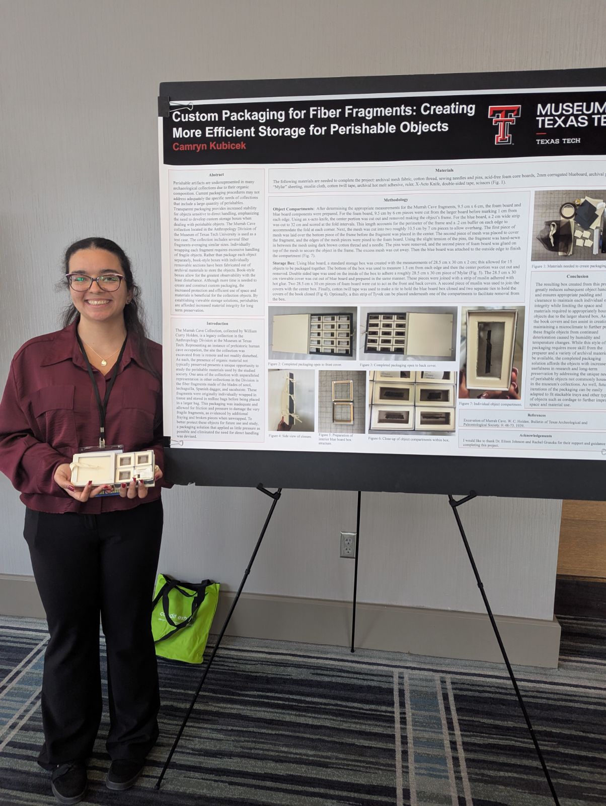 poster student standing in front of poster