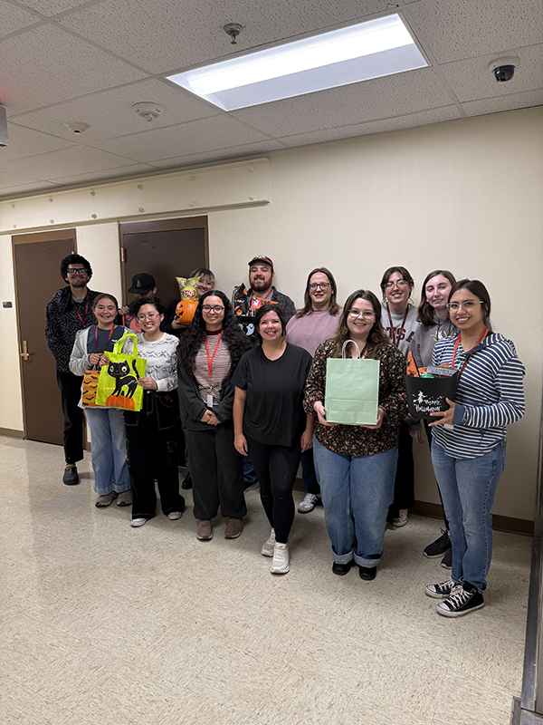 Museum Heritage and Student Association 2025 Students Students standing for photo with Halloween candy