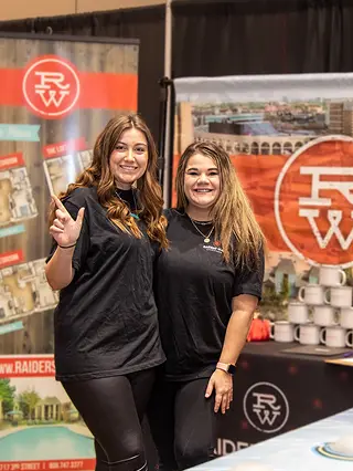 Property representatives at an Off-Campus Housing Fair booth.