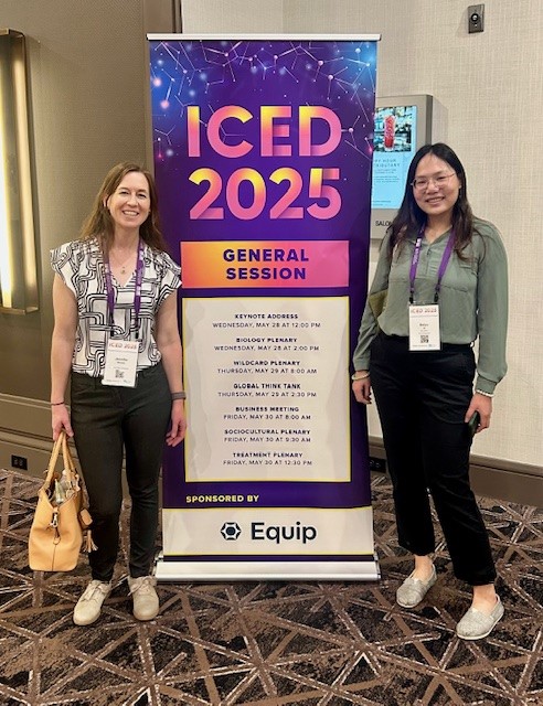 Jen and Baiyu next to ICED 2025 sign