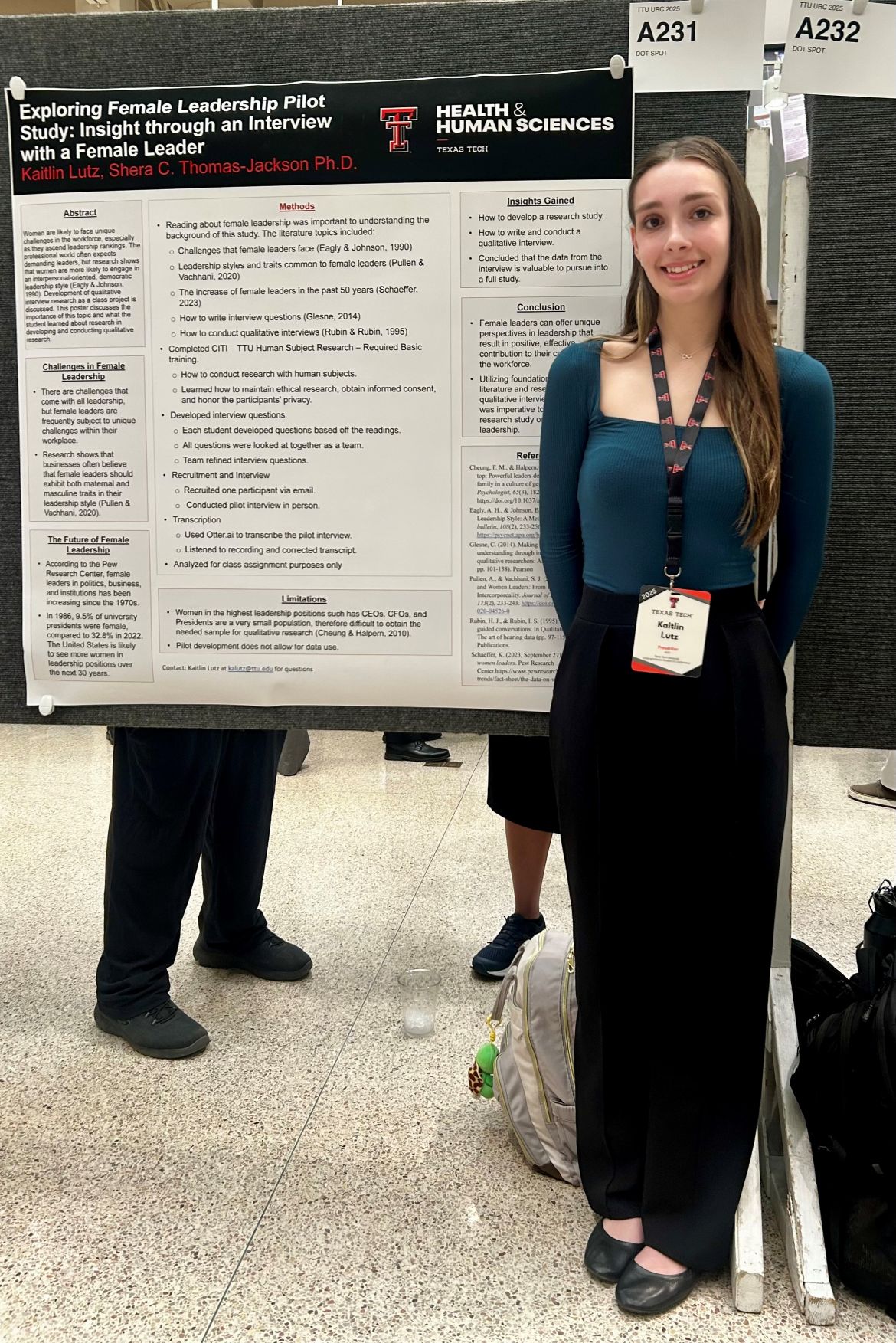 Kaitlin next to URC poster