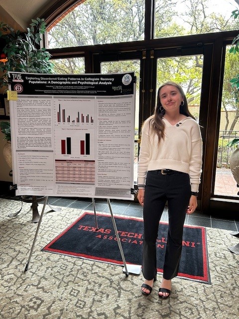 Trinity next to McKenzie Lectureship poster
