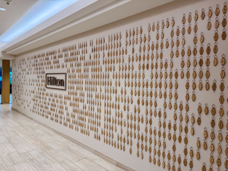 hilton wall full of dog tag key chains 