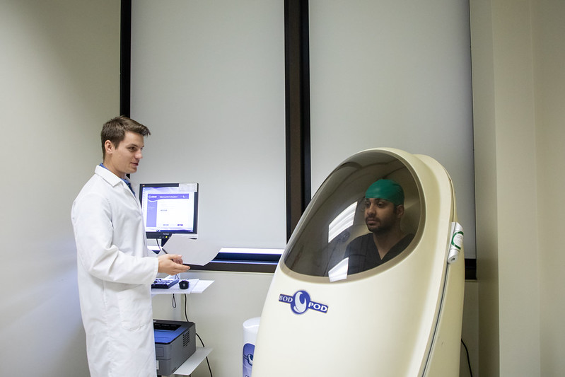 Nutrition & Metabolic Health Initiative Weight Loss Texas Tech Photo of student working on Bod Pod Gold Standard Body Composition testing at NMHI.