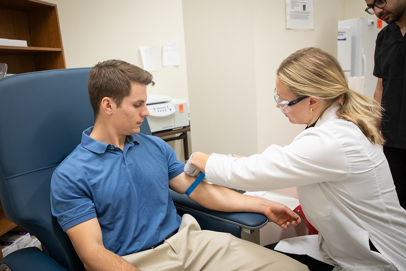 Nutrition & Metabolic Health Initiative Weight Loss Texas Tech Marleigh performing phlebotomy.