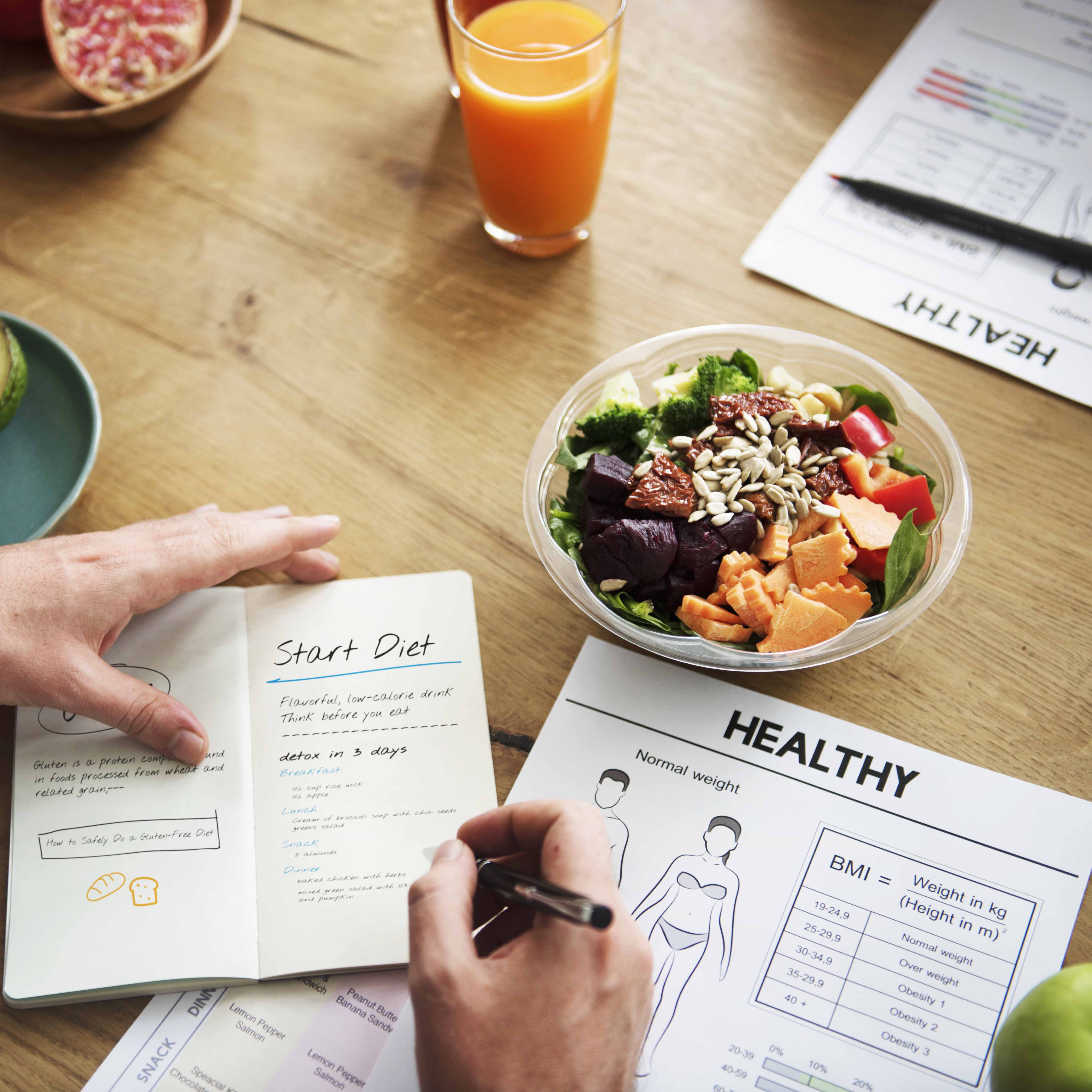 Photo of healthy salad and meal planner, part of NMHI Optifast science-based weight loss program.