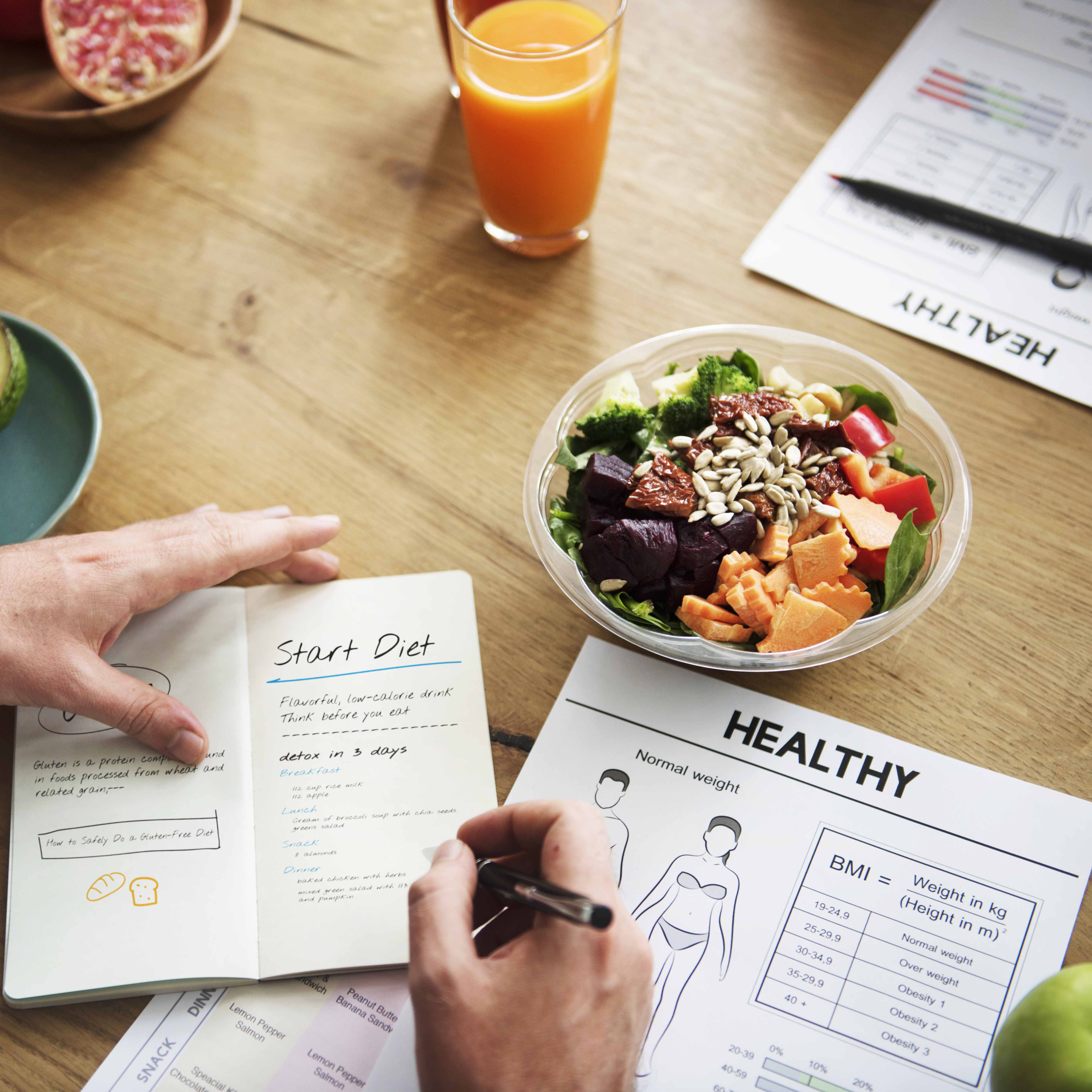 Nutrition & Metabolic Health Initiative Weight Loss Texas Tech Photo of healthy salad and meal planner, part of NMHI Optifast science-based weight loss program.