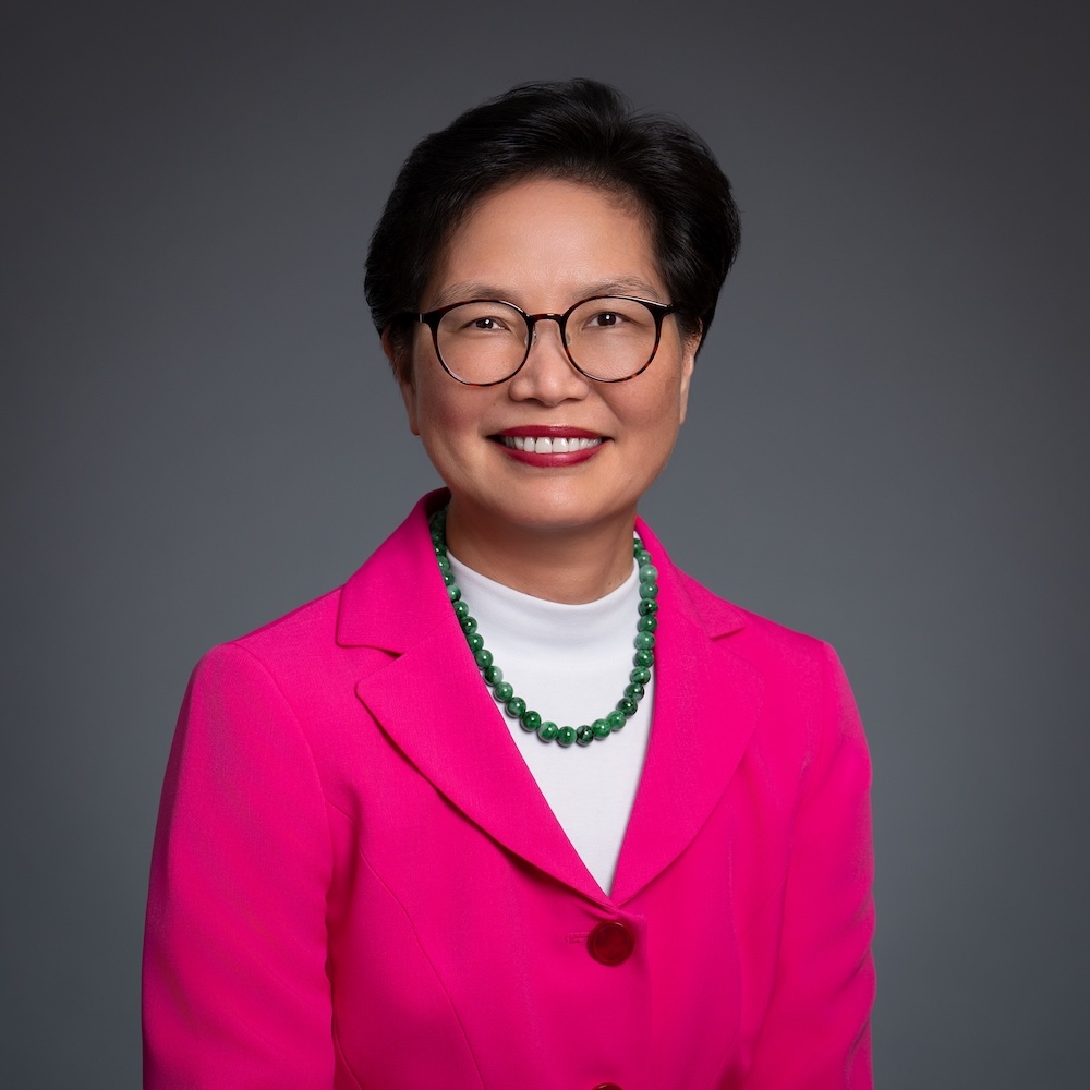 Chia-Li Chien smiling at camera in pink blazer