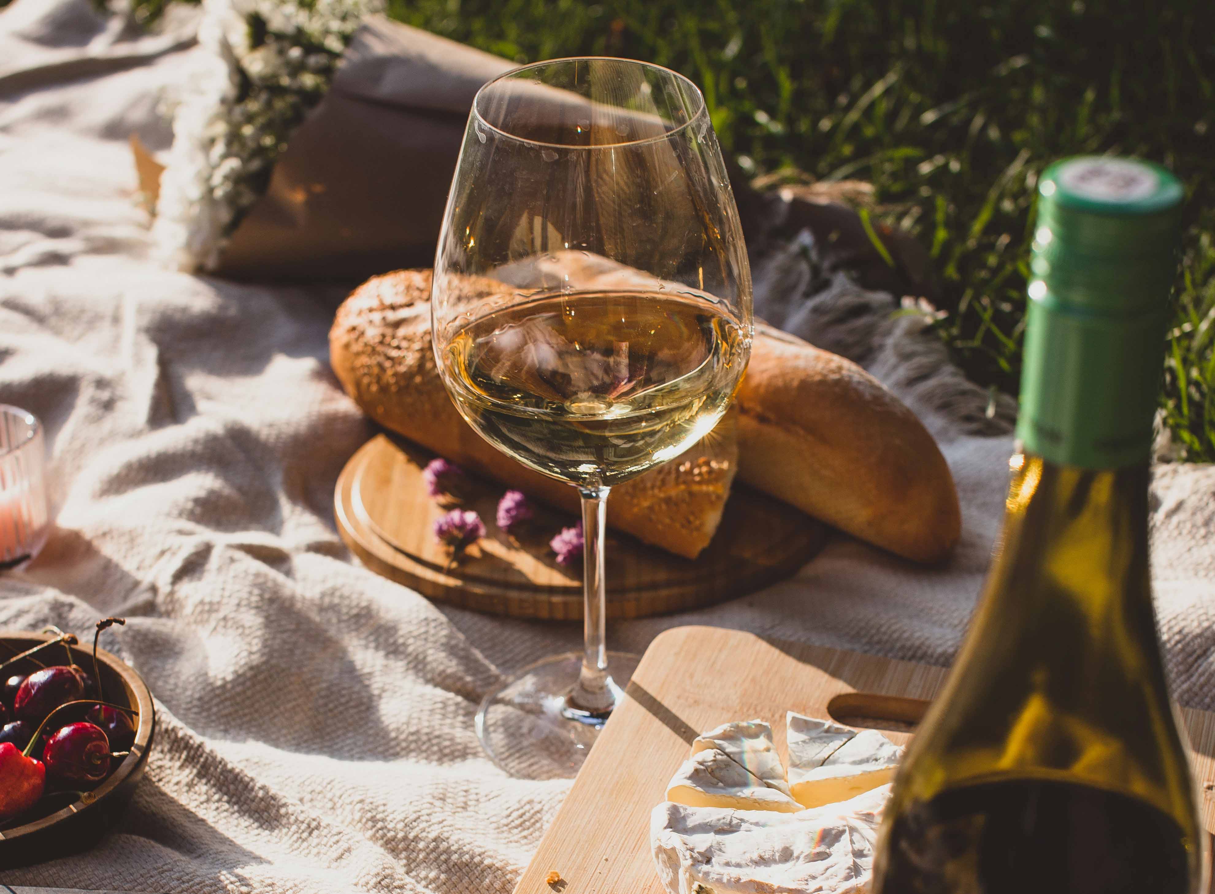 Wine glass on picnic blanket