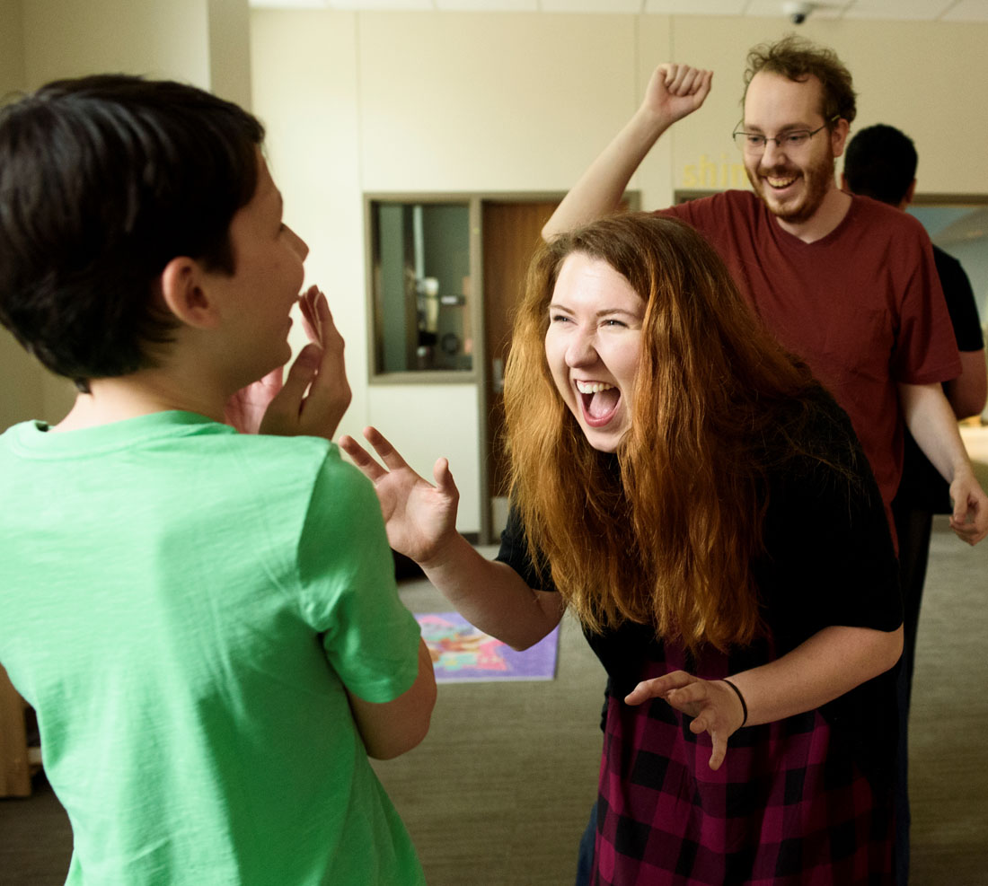 TTU DIA faculty laughing and congratulation a student that is a minor