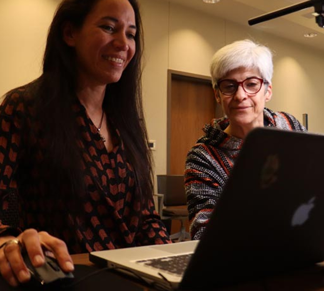 TTU Student & faculty at a computer