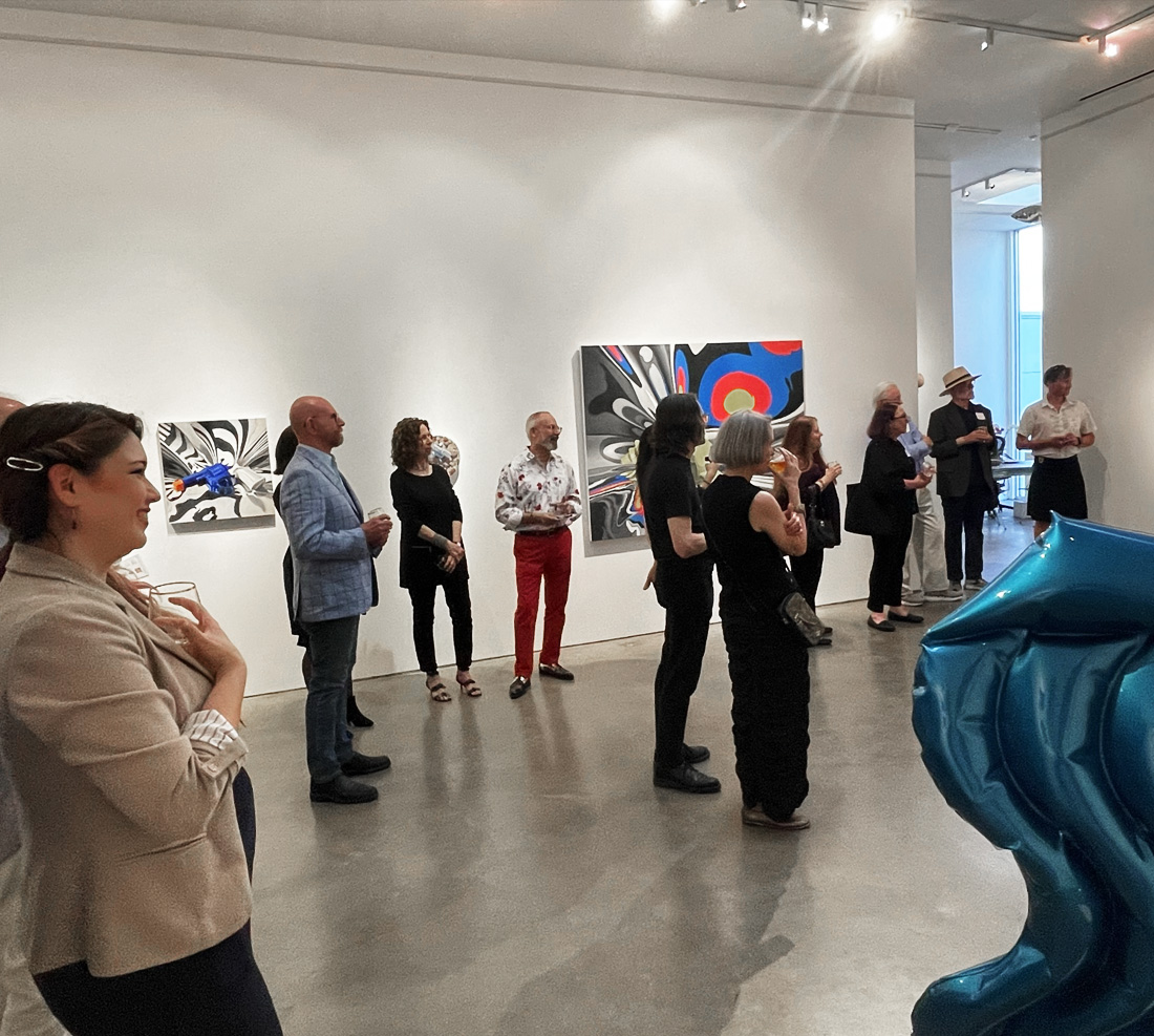 People standing around at an art exhibit