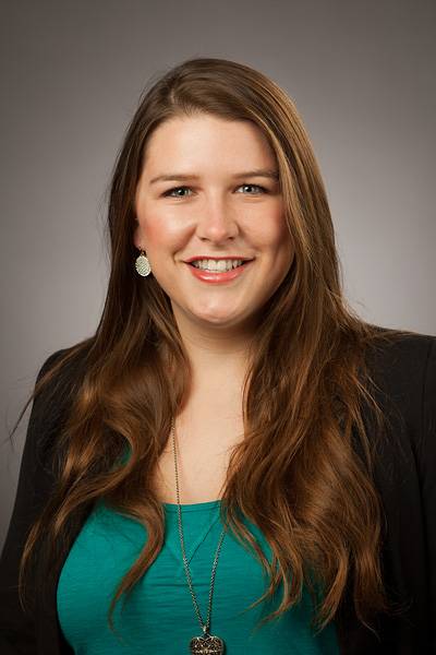 Bethany Kuwitzky in black blazer and green shirt