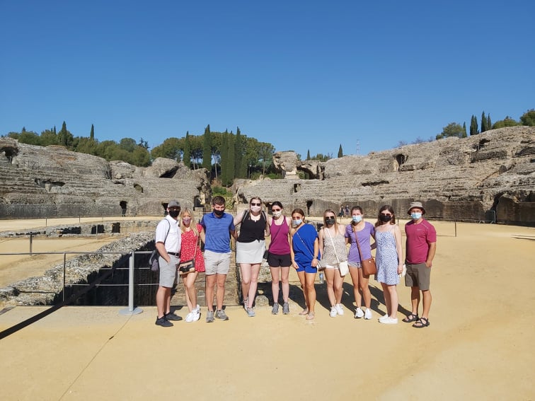 Students standing in a Roman amphitheater.