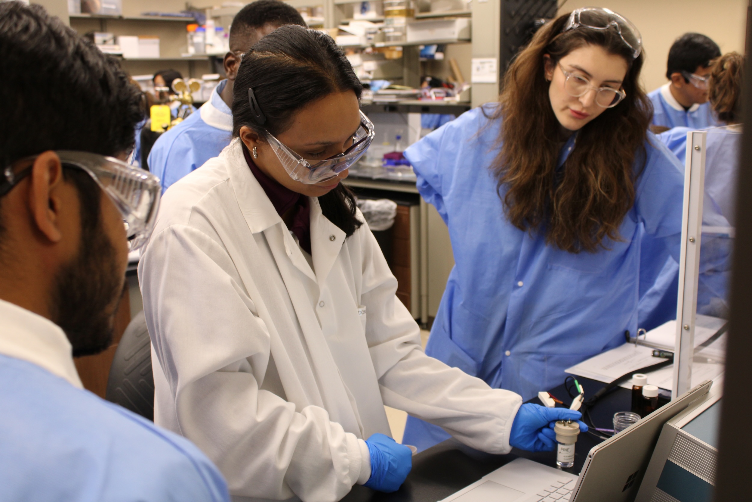 ISCE students doing experiments in a lab